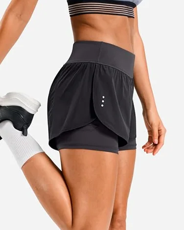 A Soothfeel 2-in-1 pair: the fitted liner sits under the loose outer short, and the phone pocket rides on the liner rather than swinging from the outer hem.